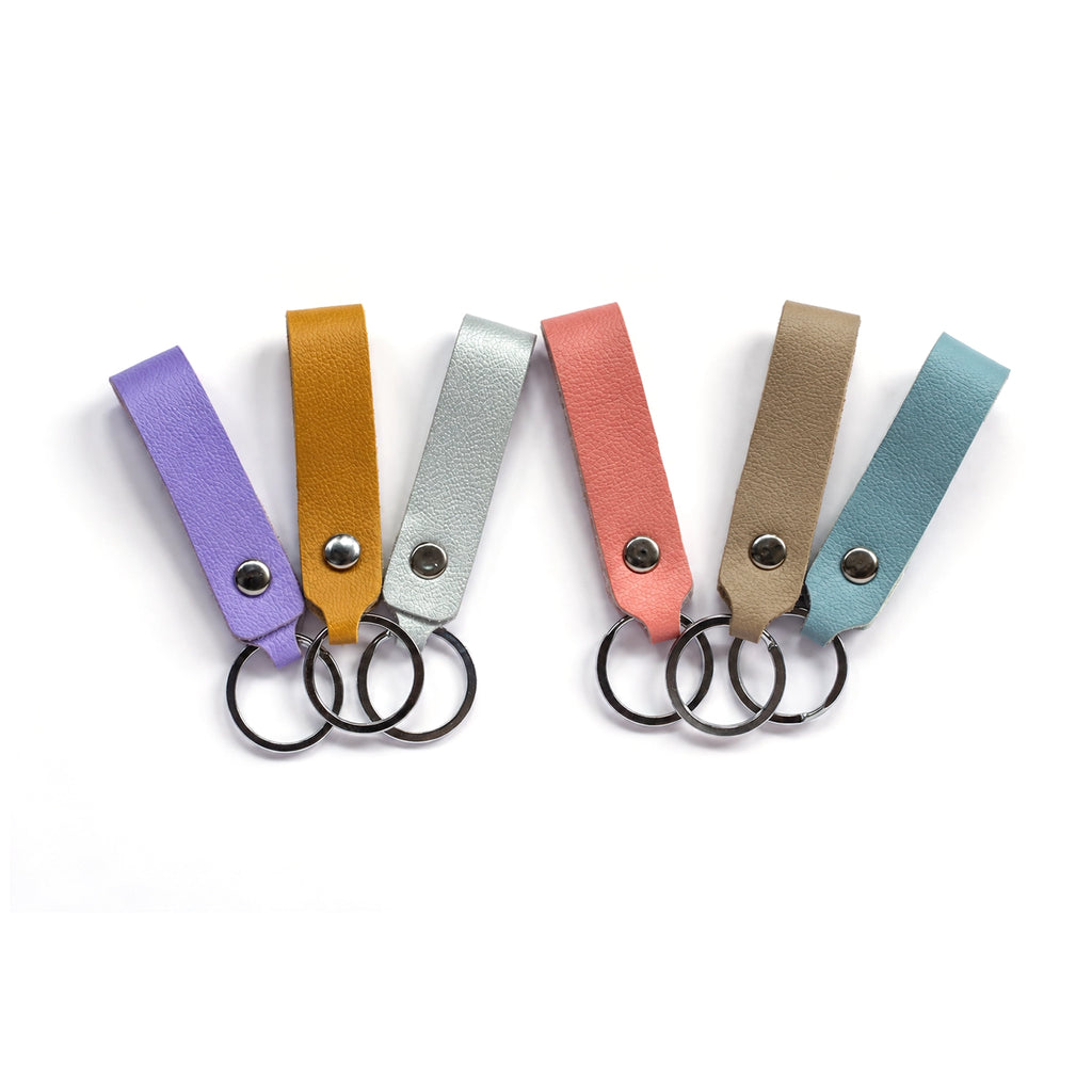 Leather strap keychains in lilac, mustard, silver, coral, beige and sky blue