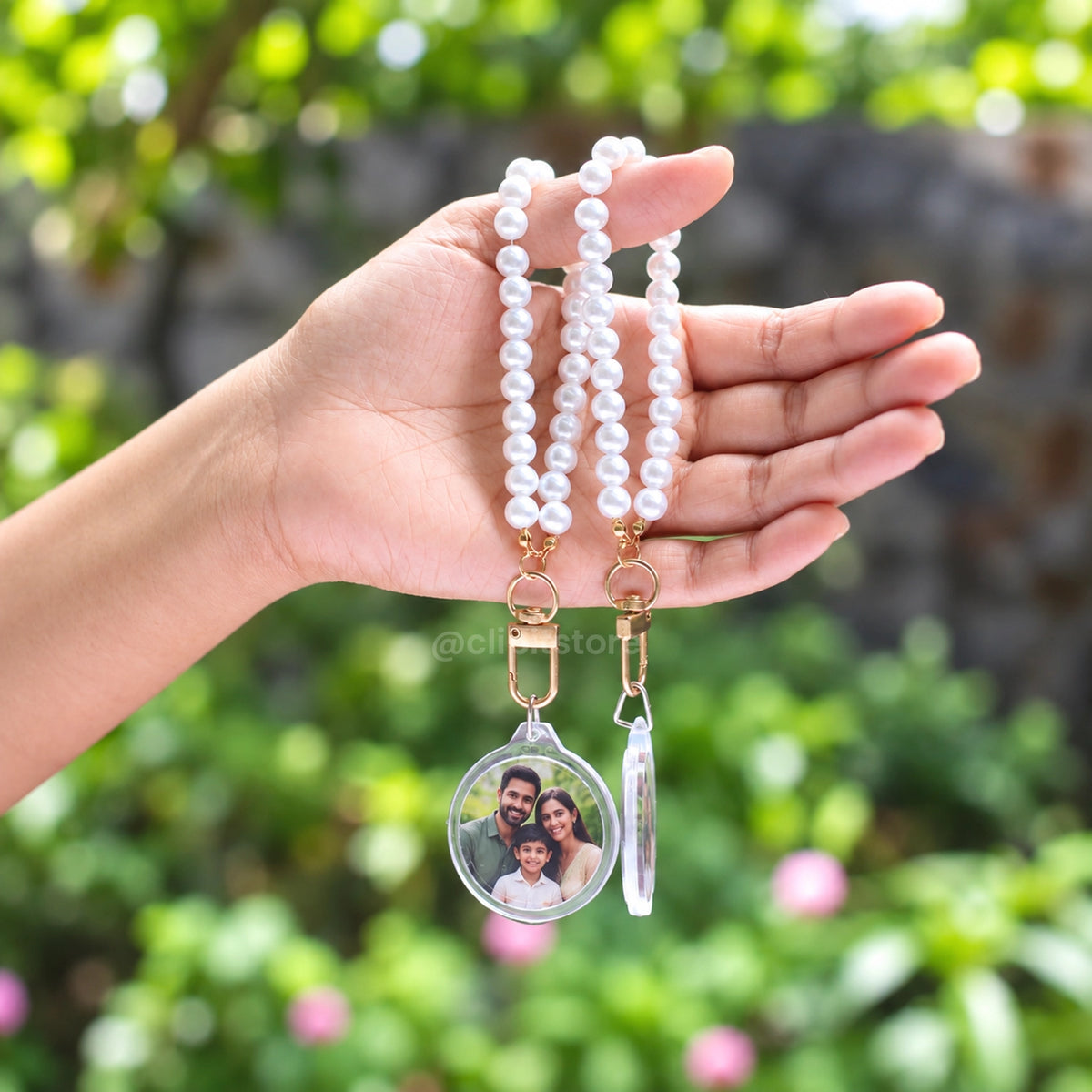 Pearl wristlet keychain showing both printed sides of the acrylic disc